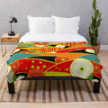 Colorful abstract plush blanket with a surreal, fantasy landscape design