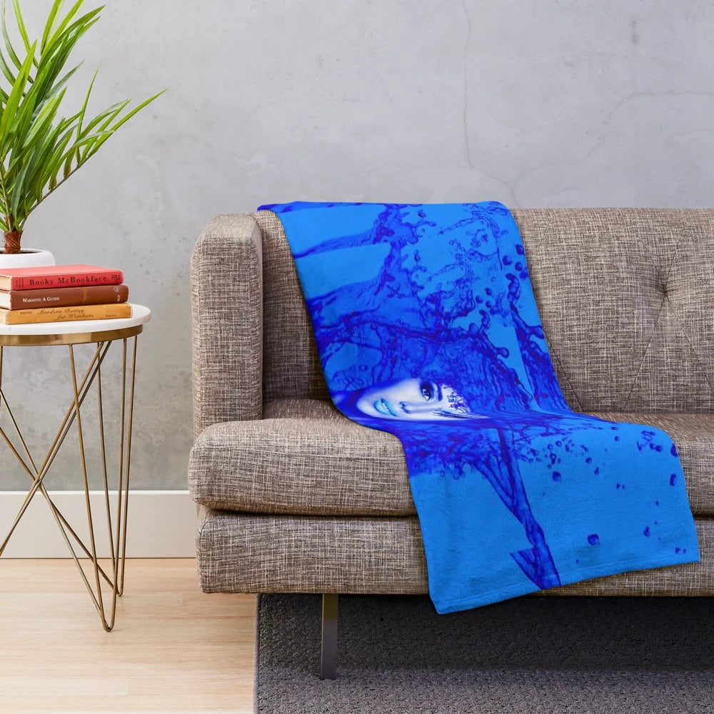 Soft, plush blue and white patterned blanket with abstract contemporary design