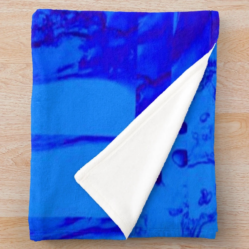 Soft, plush blue and white patterned blanket with abstract contemporary design