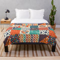 Colorful plush blanket with abstract tribal-inspired patterns