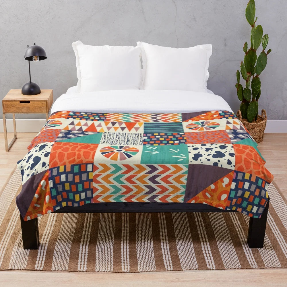 Colorful plush blanket with abstract tribal-inspired patterns