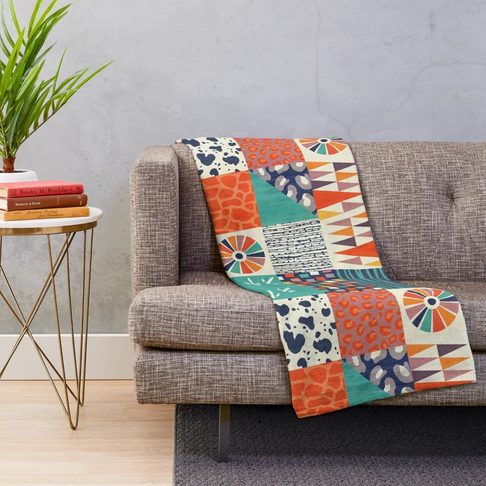 Colorful plush blanket with abstract tribal-inspired patterns