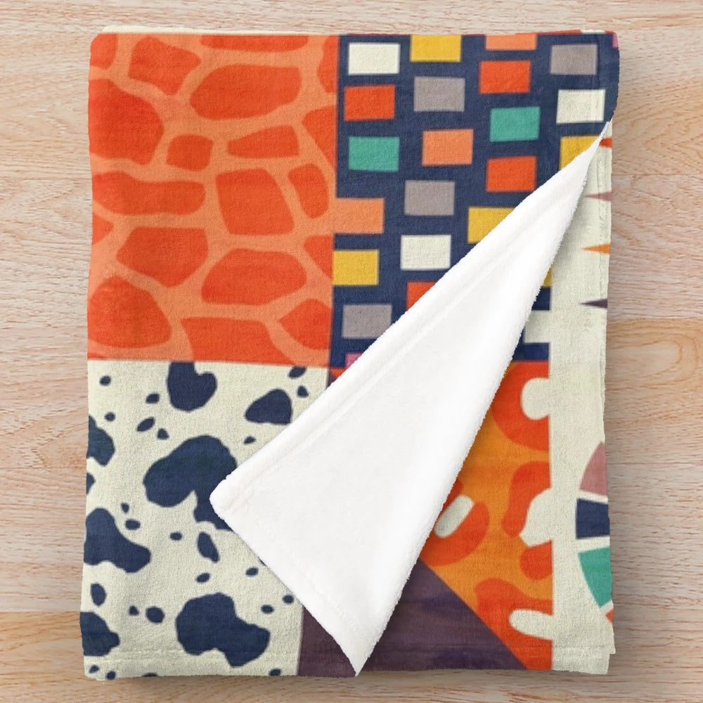 Colorful plush blanket with abstract tribal-inspired patterns