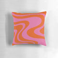 Vibrant abstract retro swirl pattern on a decorative throw pillow