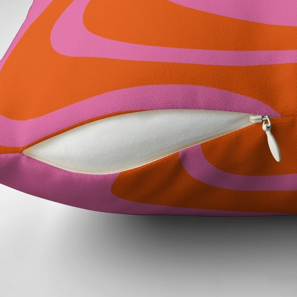 Vibrant abstract retro swirl pattern on a decorative throw pillow