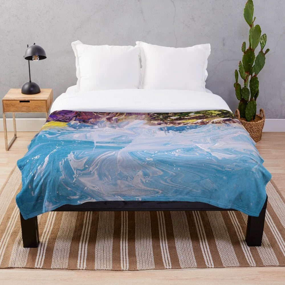 Colorful abstract splash pattern on a soft, modern plush blanket