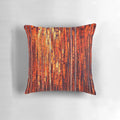 Decorative throw pillow with abstract orange and yellow stripe pattern