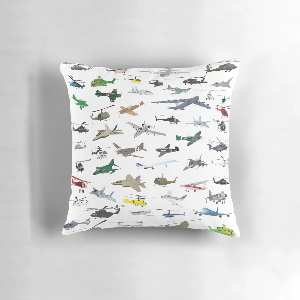Colorful pillow featuring a diverse pattern of airplanes, helicopters, and military aircraft.