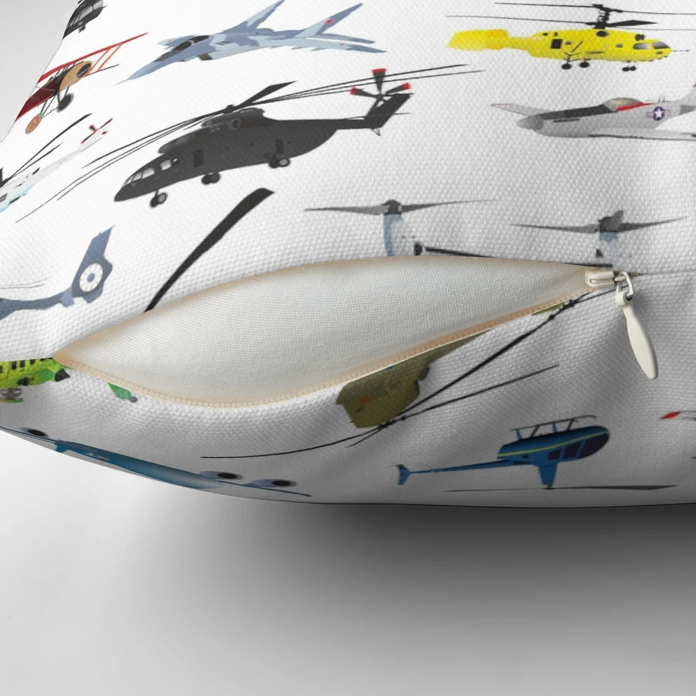 Colorful pillow featuring a diverse pattern of airplanes, helicopters, and military aircraft.