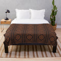 Ekai orange and black African tribal pattern plush blanket with bohemian geometric mudcloth design