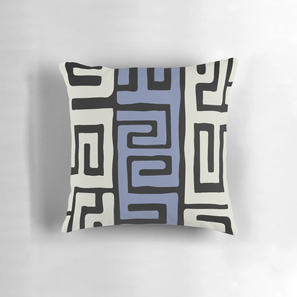 Decorative throw pillow featuring a vibrant African kuba fabric inspired pattern in cream and powder blue.