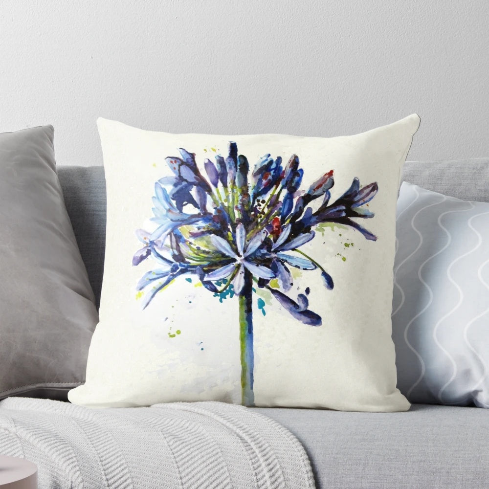 Decorative pillow featuring a beautiful, blue agapanthus flower in bloom