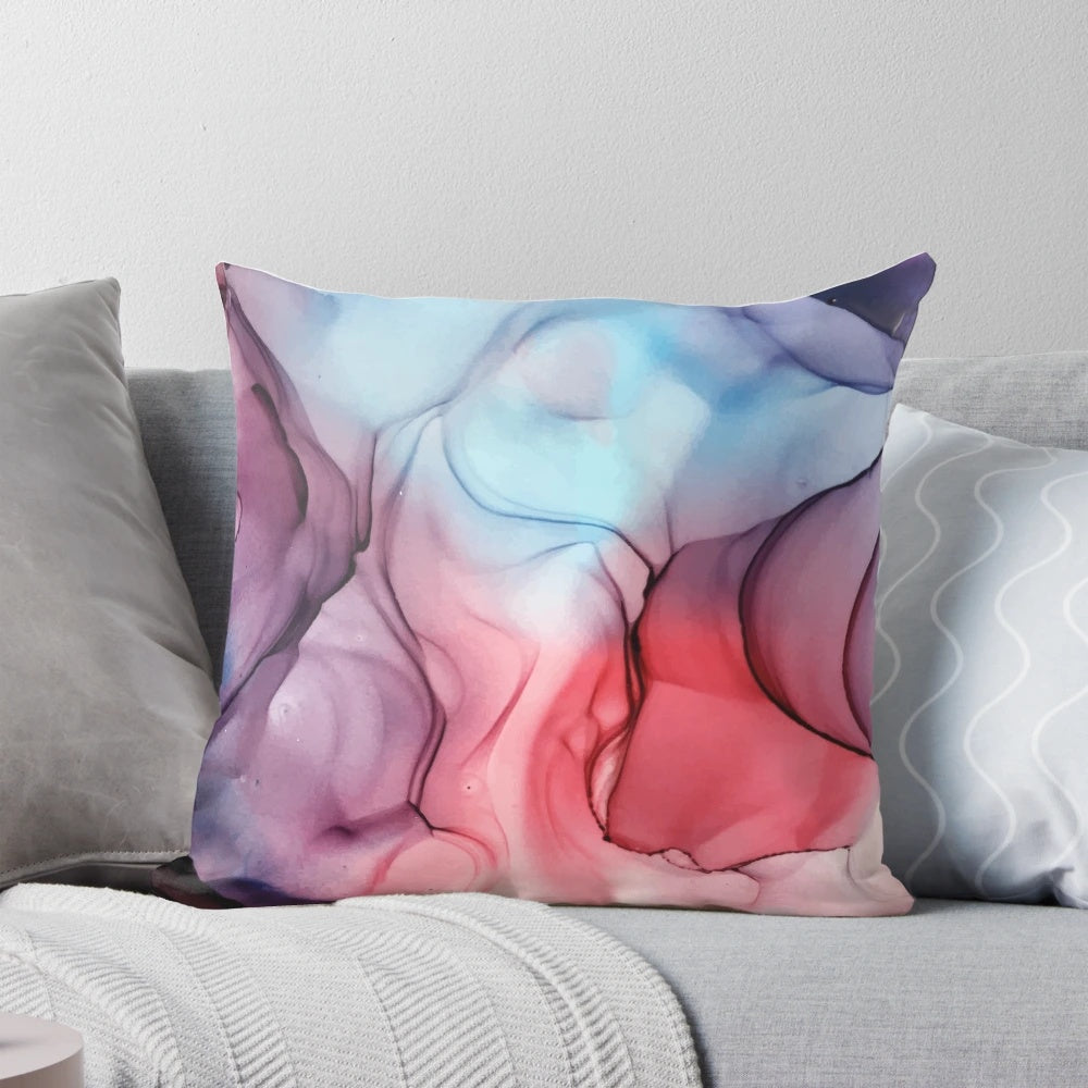 A vibrant abstract alcohol ink painting pillow featuring a bold, expressive flame-inspired design in shades of pink, purple, and blue.
