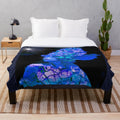 Colorful plush blanket with abstract alien world design