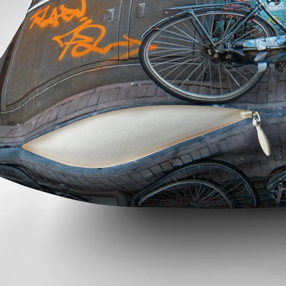 Colorful pillow featuring vibrant Amsterdam street art with graffiti, bicycles, and artistic characters
