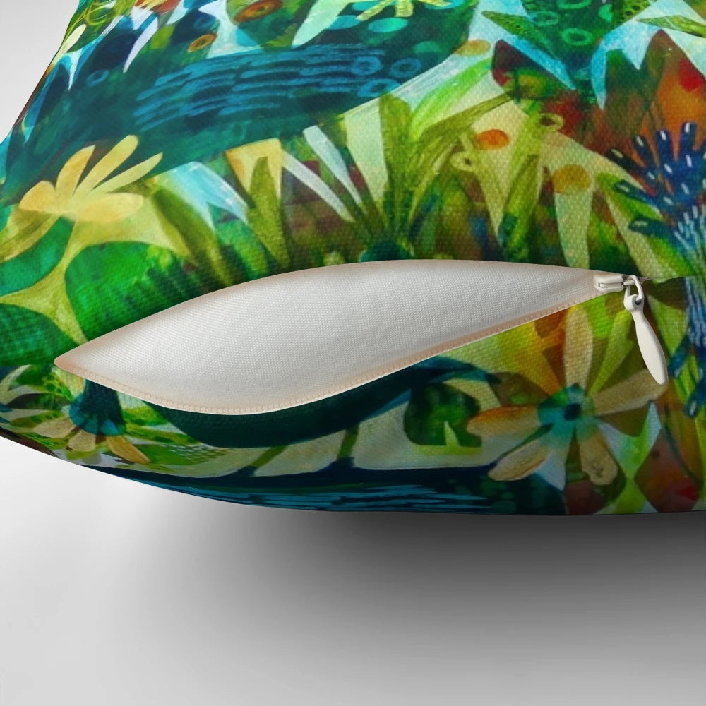 Colorful and unique Este MacLeod designed pillow with birds and flowers in a garden setting.
