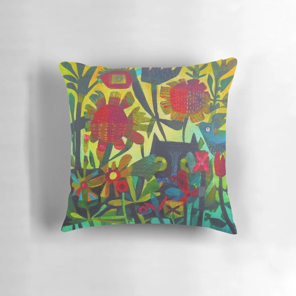 Colorful and bold Felix cat-shaped pillow with flowers and greenery