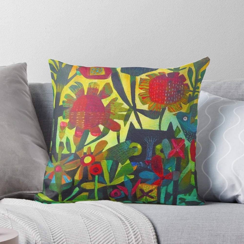 Colorful and bold Felix cat-shaped pillow with flowers and greenery
