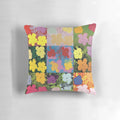 Colorful throw pillow featuring an Andy Warhol-style print of pink, yellow, and orange flowers