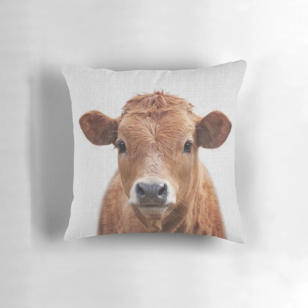 Colorful pillow featuring a striking black and white cow illustration, perfect for adding a nature-inspired touch to any room.