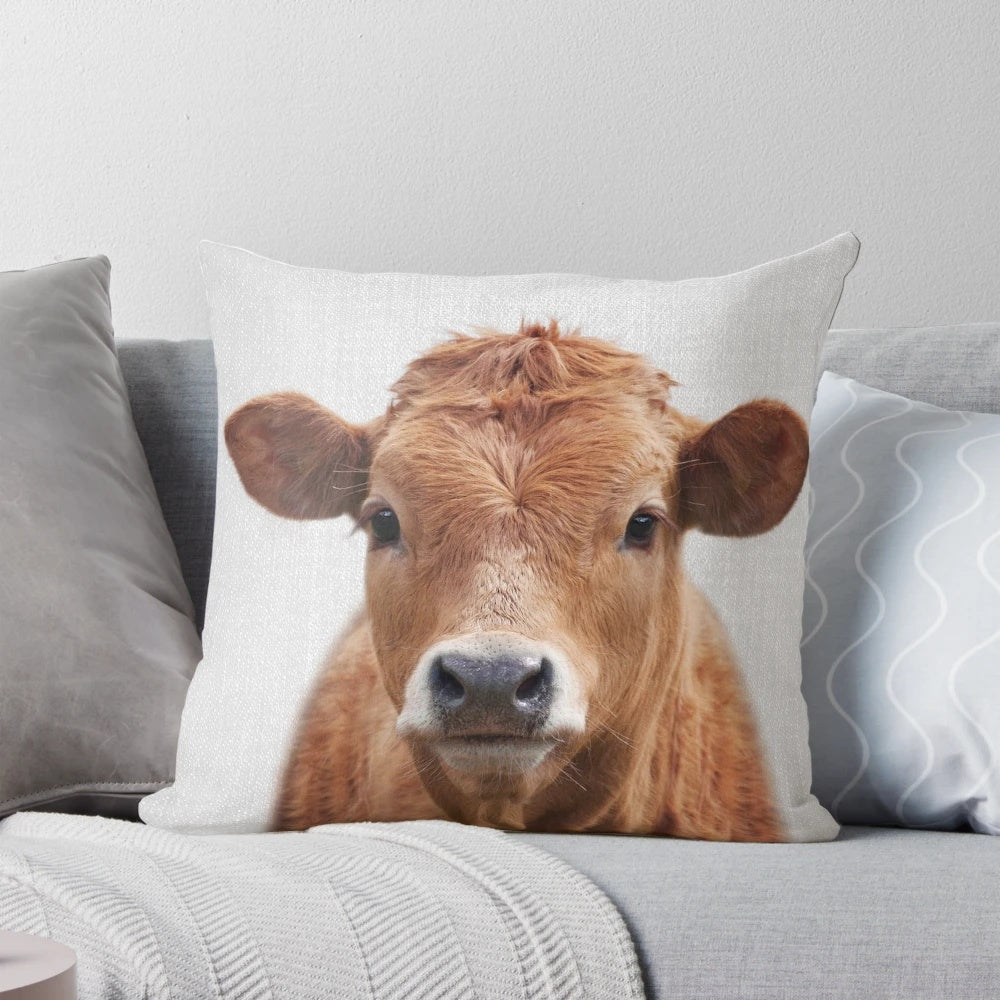 Colorful pillow featuring a striking black and white cow illustration, perfect for adding a nature-inspired touch to any room.