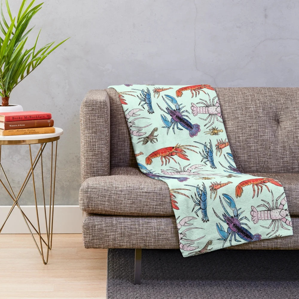 Colorful plush blanket featuring watercolor illustrations of aquatic crayfish species