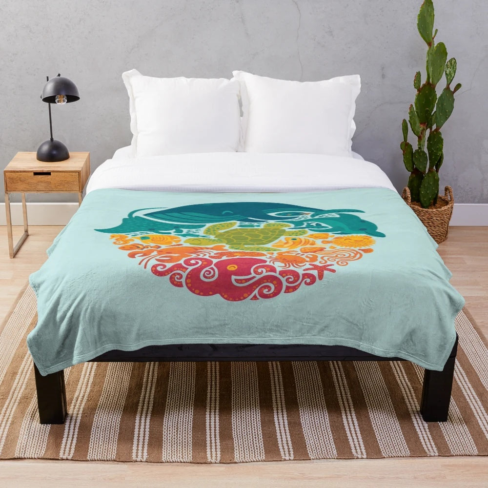 Aquatic plush blanket with vibrant sea creatures and marine life