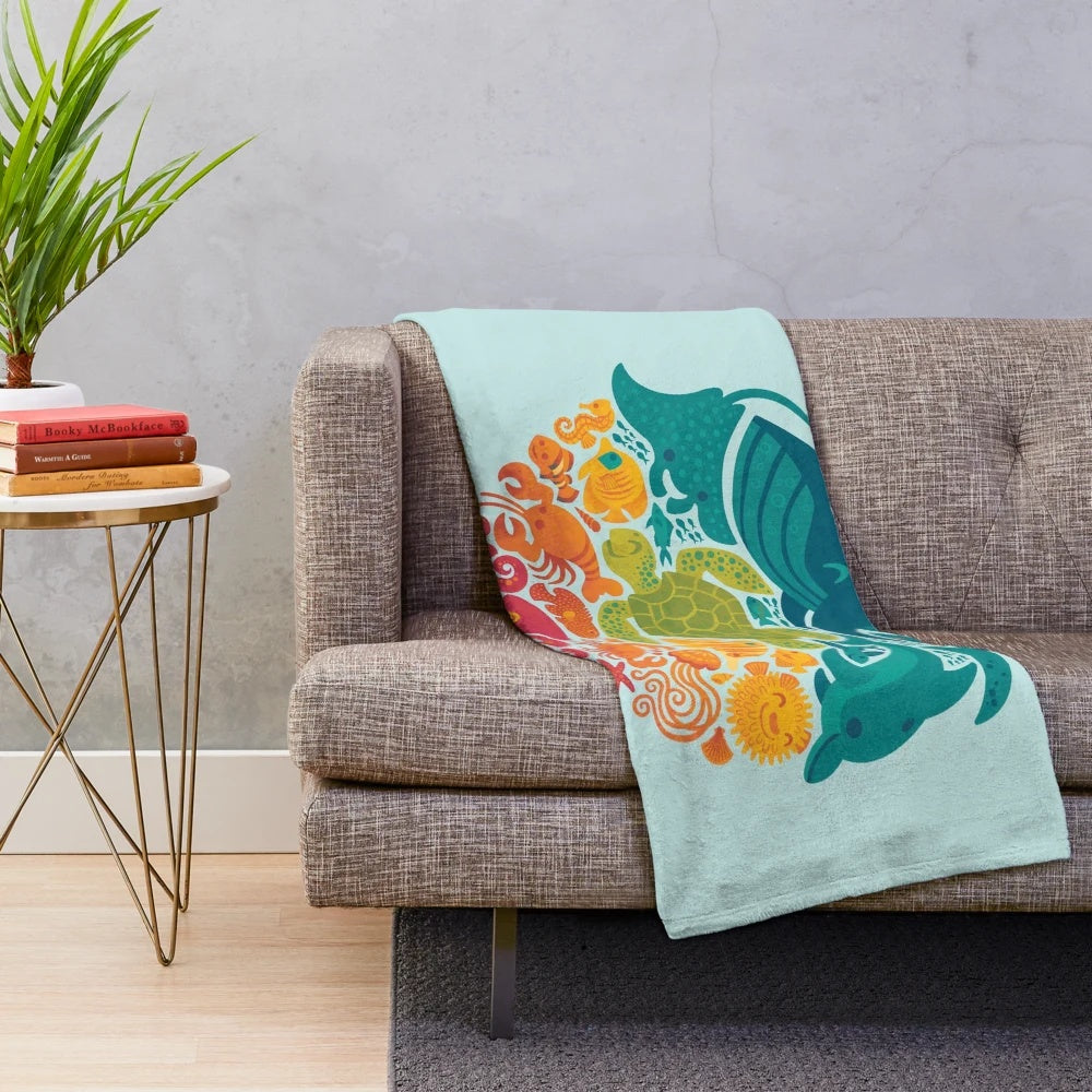 Aquatic plush blanket with vibrant sea creatures and marine life