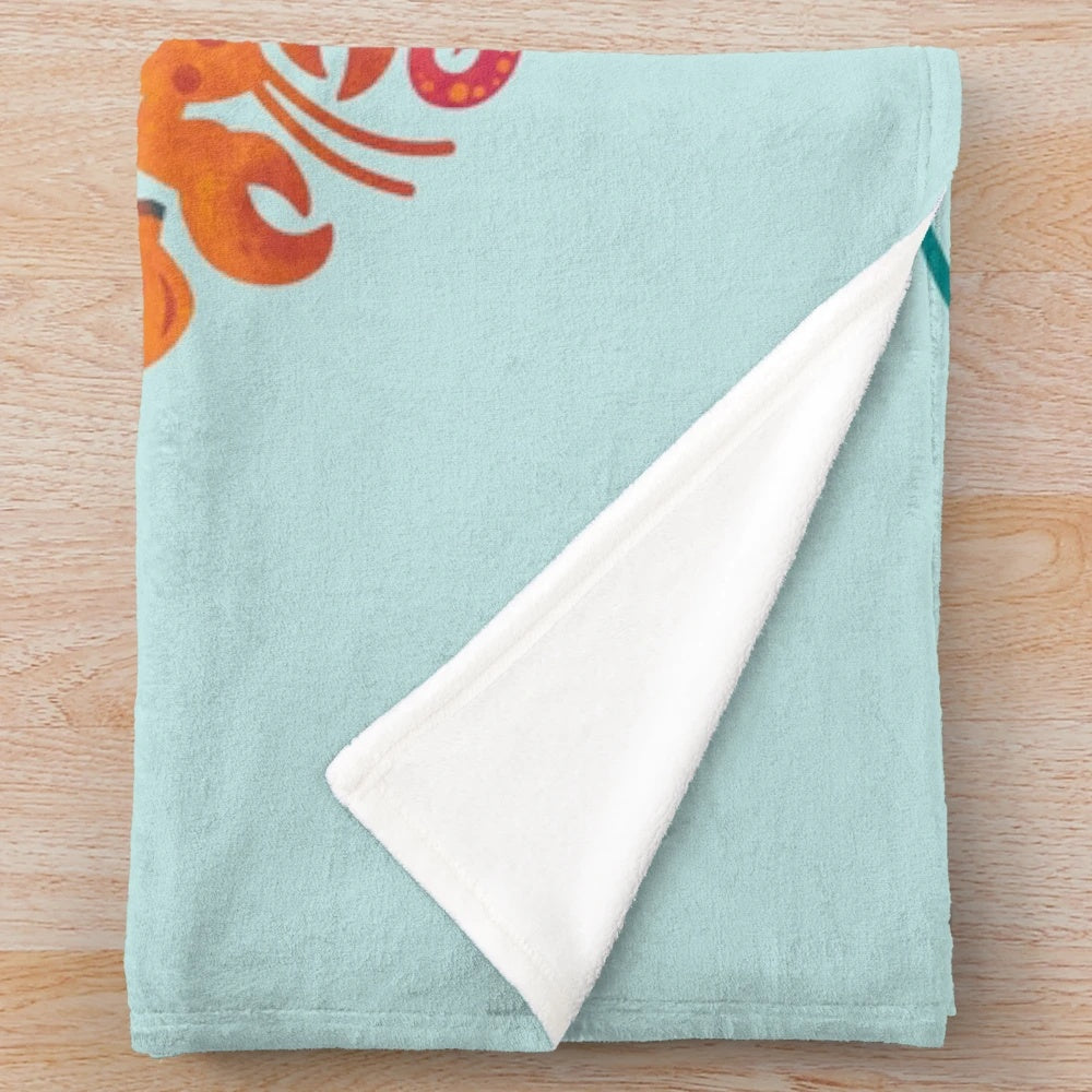Aquatic plush blanket with vibrant sea creatures and marine life