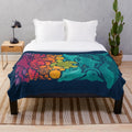Plush blanket with colorful aquatic spectrum design featuring various ocean creatures