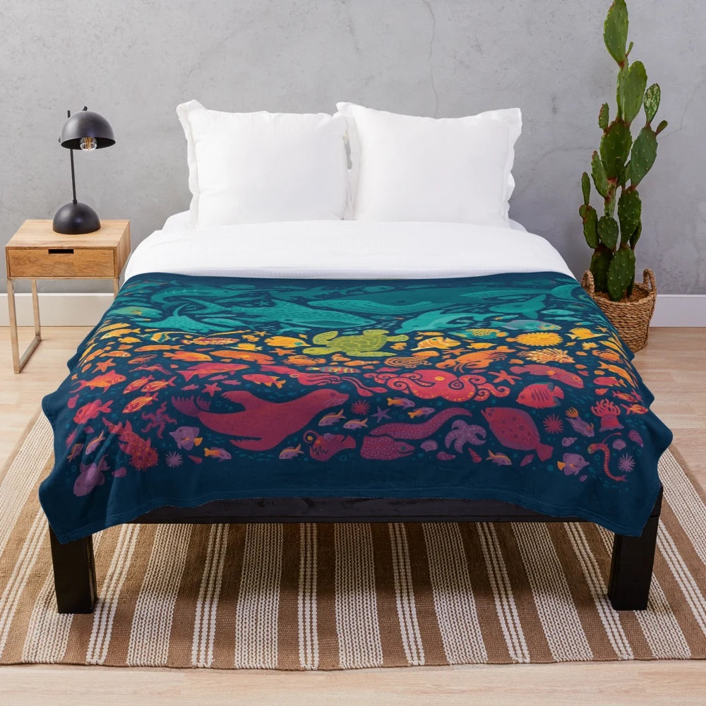 Vibrant Aquatic Spectrum Plush Blanket featuring a variety of colorful sea life