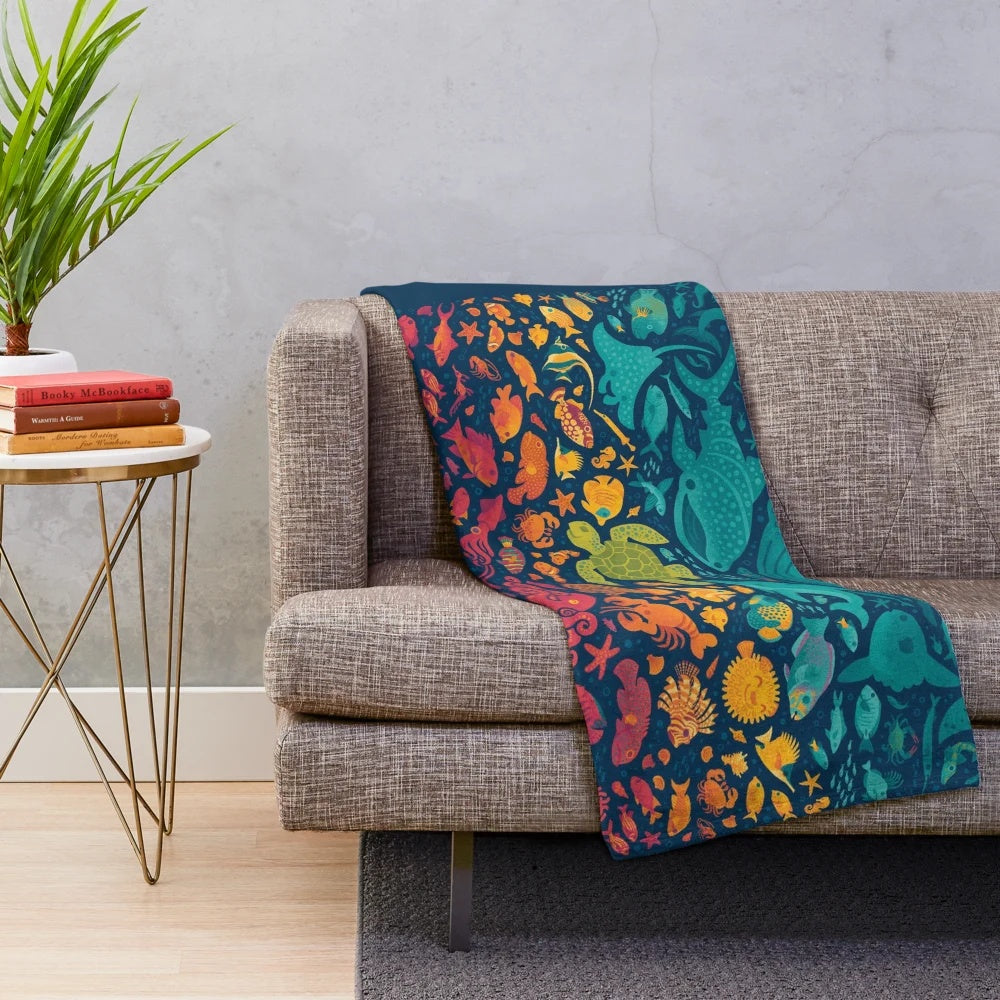 Vibrant Aquatic Spectrum Plush Blanket featuring a variety of colorful sea life