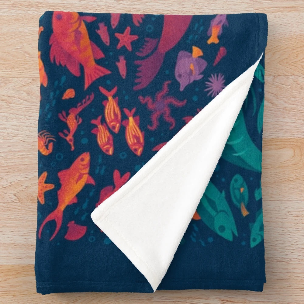 Vibrant Aquatic Spectrum Plush Blanket featuring a variety of colorful sea life