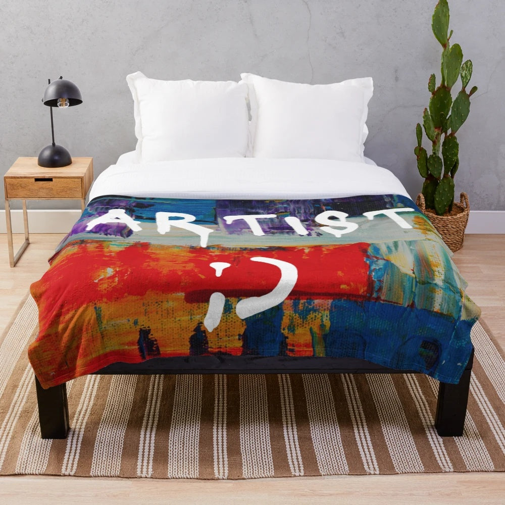 Colorful plush blanket with artist-inspired paint splatters and strokes