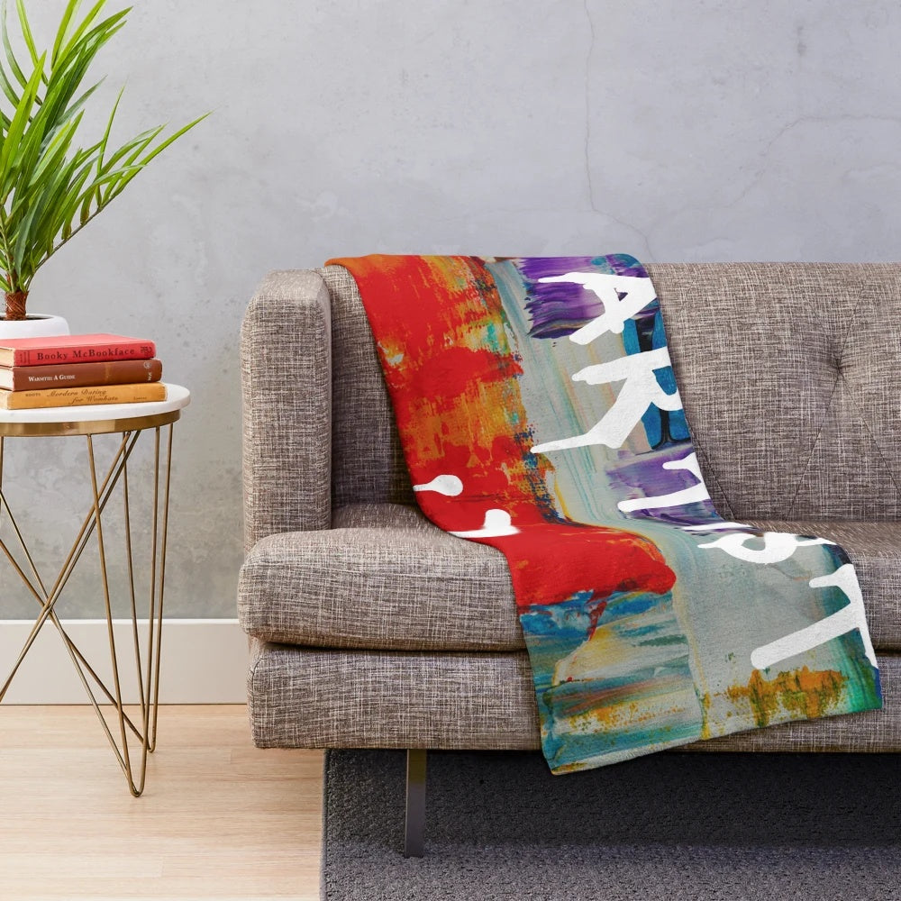 Colorful plush blanket with artist-inspired paint splatters and strokes