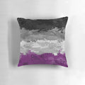 Colorful abstract paint splatter design on an asexual pride flag pattern decorative pillow.