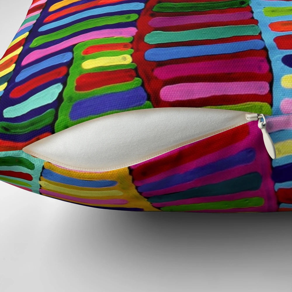 A colorful and vibrant pillow featuring a design inspired by traditional Australian aboriginal dot art.