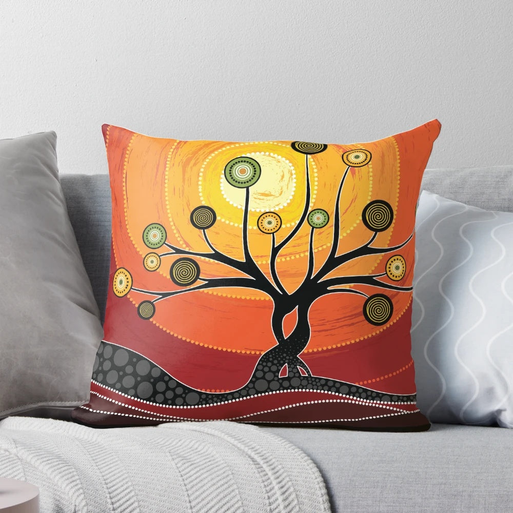 Colorful aboriginal art pillow featuring warm orange tones and traditional indigenous Australian designs.