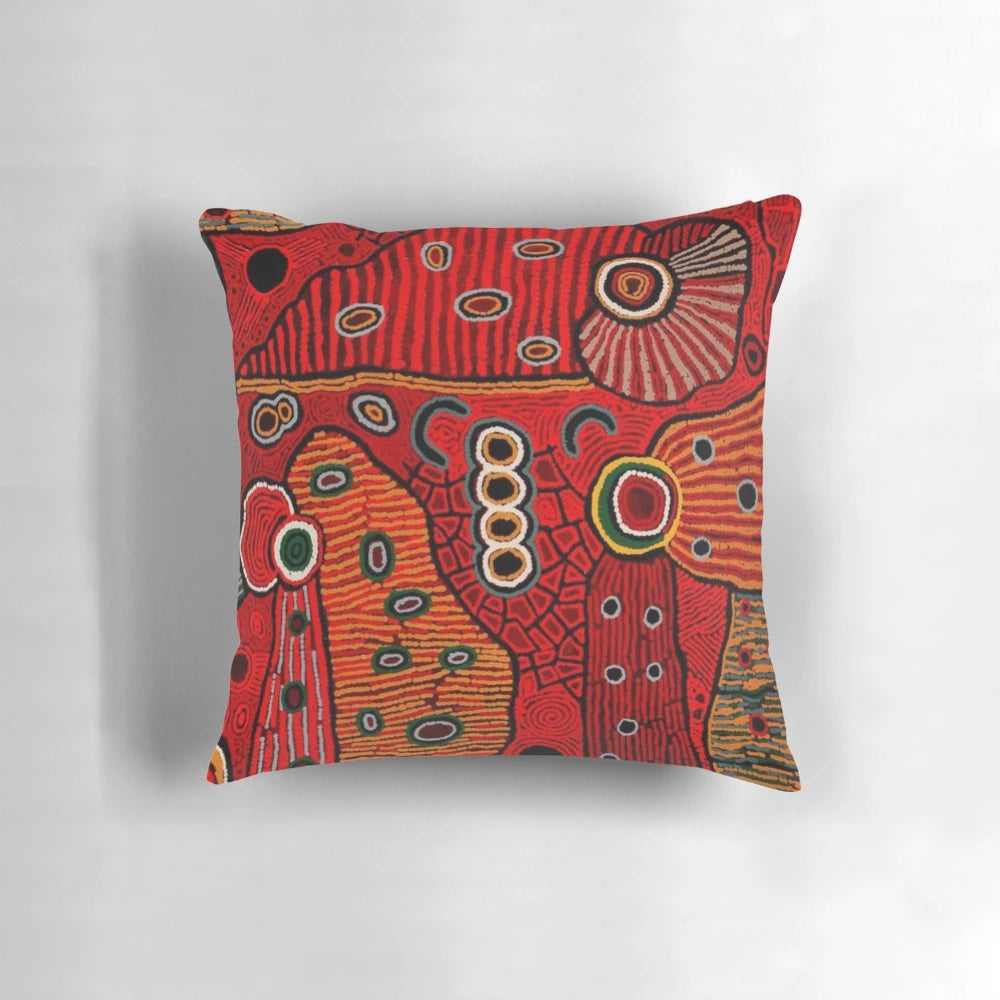 Colorful abstract Australian aboriginal-style art design on a soft throw pillow