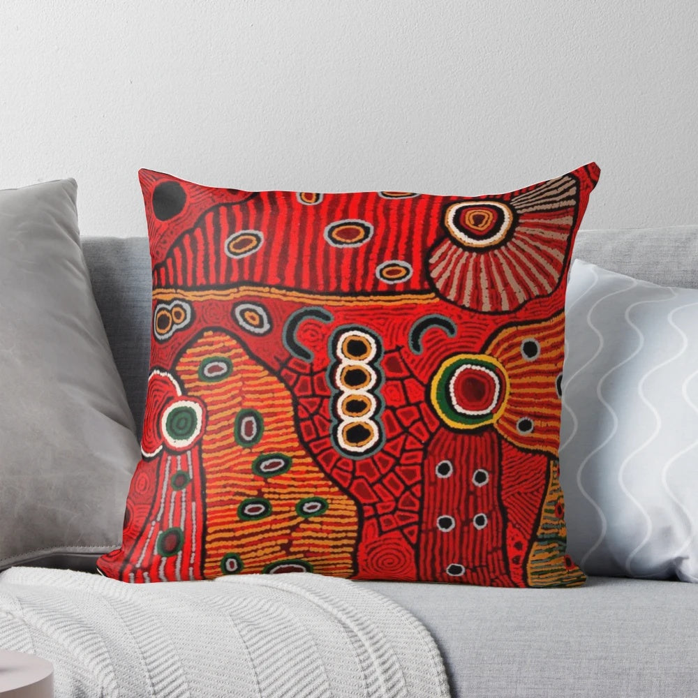 Colorful abstract Australian aboriginal-style art design on a soft throw pillow