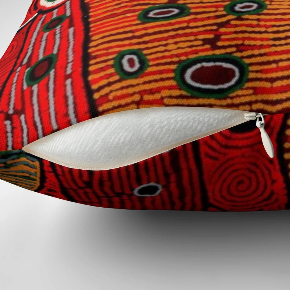 Colorful abstract Australian aboriginal-style art design on a soft throw pillow