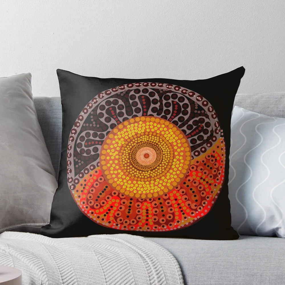 Colorful aboriginal dot art design of a sun on a decorative pillow