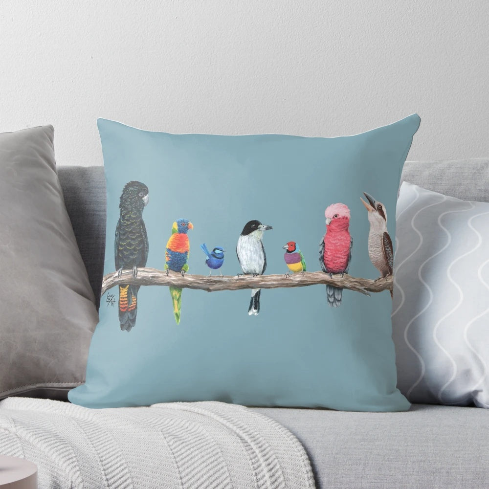 Colorful pillow featuring a variety of Australian birds, including a cockatoo, parrot, rainbow lorikeet, and fairy wren.