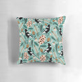 Pillow featuring an illustration of Australian magpies, banksia flowers, and other native flora