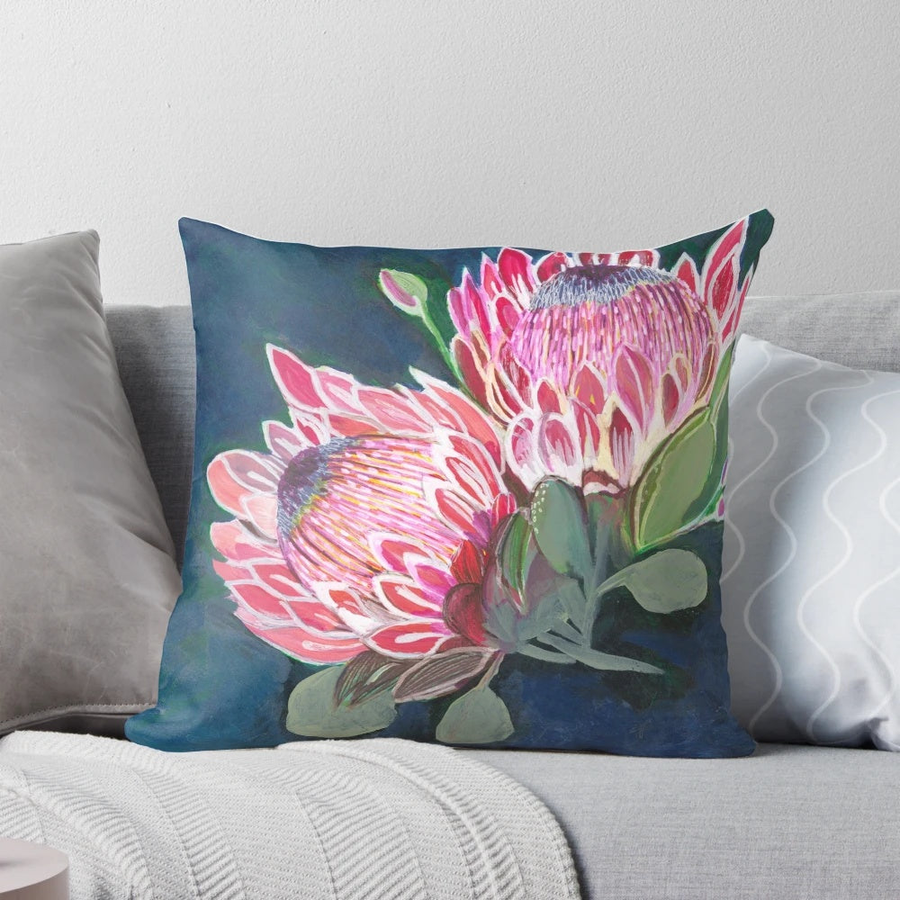 Pink and blue floral patterned decorative pillow featuring native Australian flowers