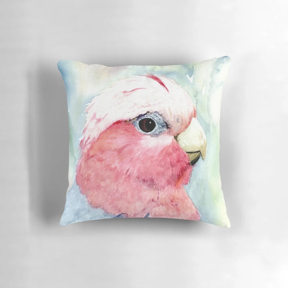 Colorful watercolor painting of an Australian galah cockatoo bird on a decorative pillow