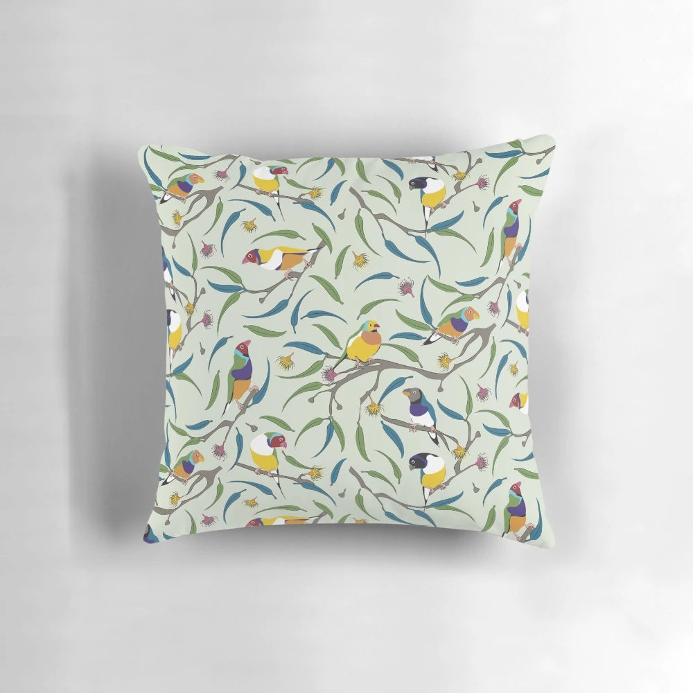 Colorful throw pillow featuring a vibrant Australian Gouldian finch, also known as the Rainbow finch.