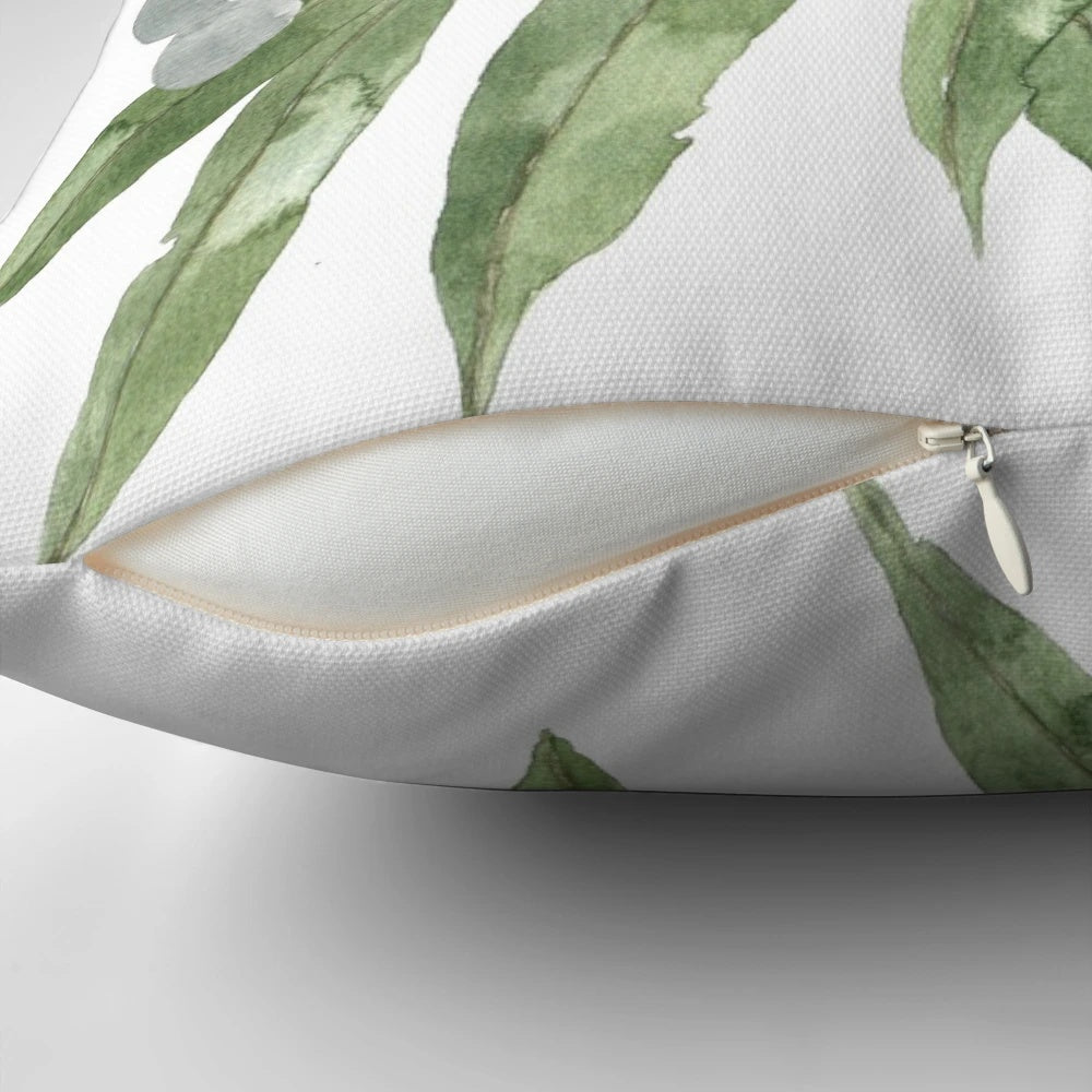 Colorful watercolor painting of Australian native bush flowers and leaves on a decorative pillow