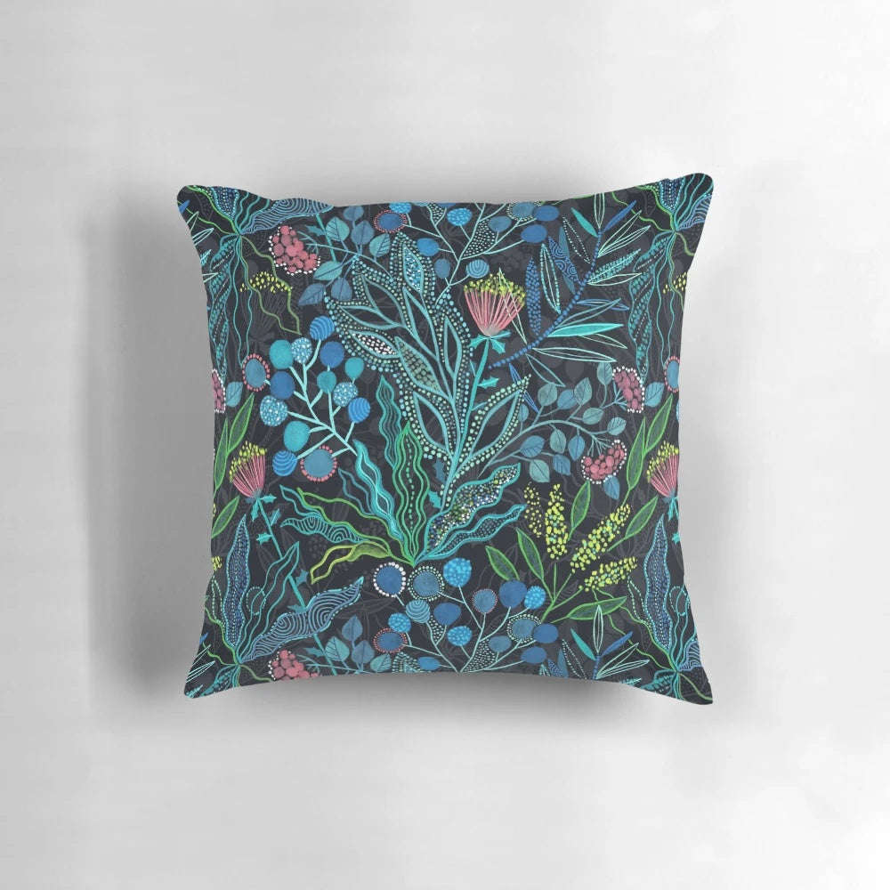 Lush, colorful pillow featuring a seamless pattern of Australian plants and flowers in a watercolor style.