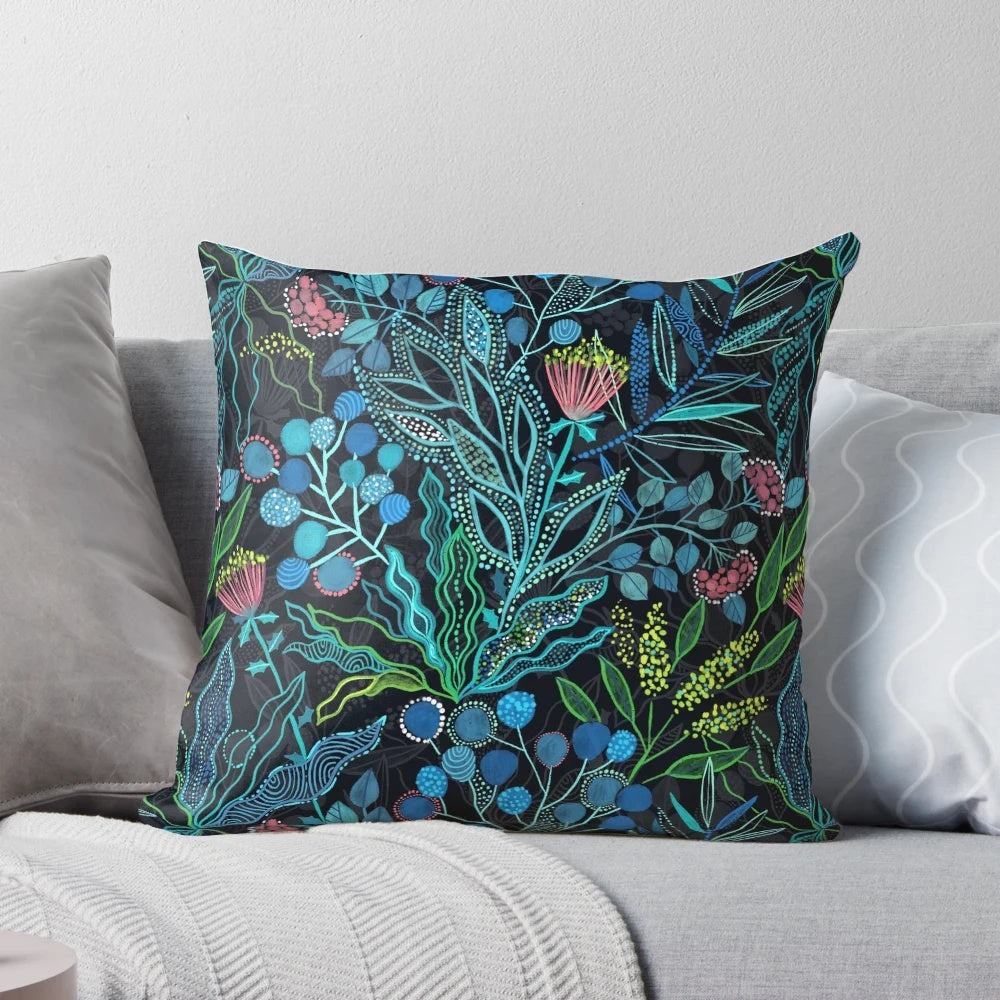 Lush, colorful pillow featuring a seamless pattern of Australian plants and flowers in a watercolor style.